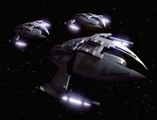 Several Star Trek Jem'Hadar ships are flying in formation