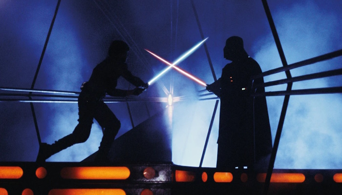 Two men fight with lightsabers